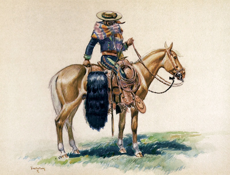 a vaquero with his grizzly bear saddle bags astride a palomino