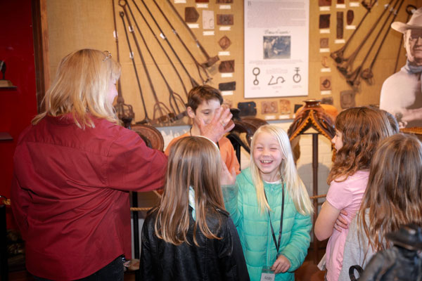 group of kids enjoying a tour of the museum